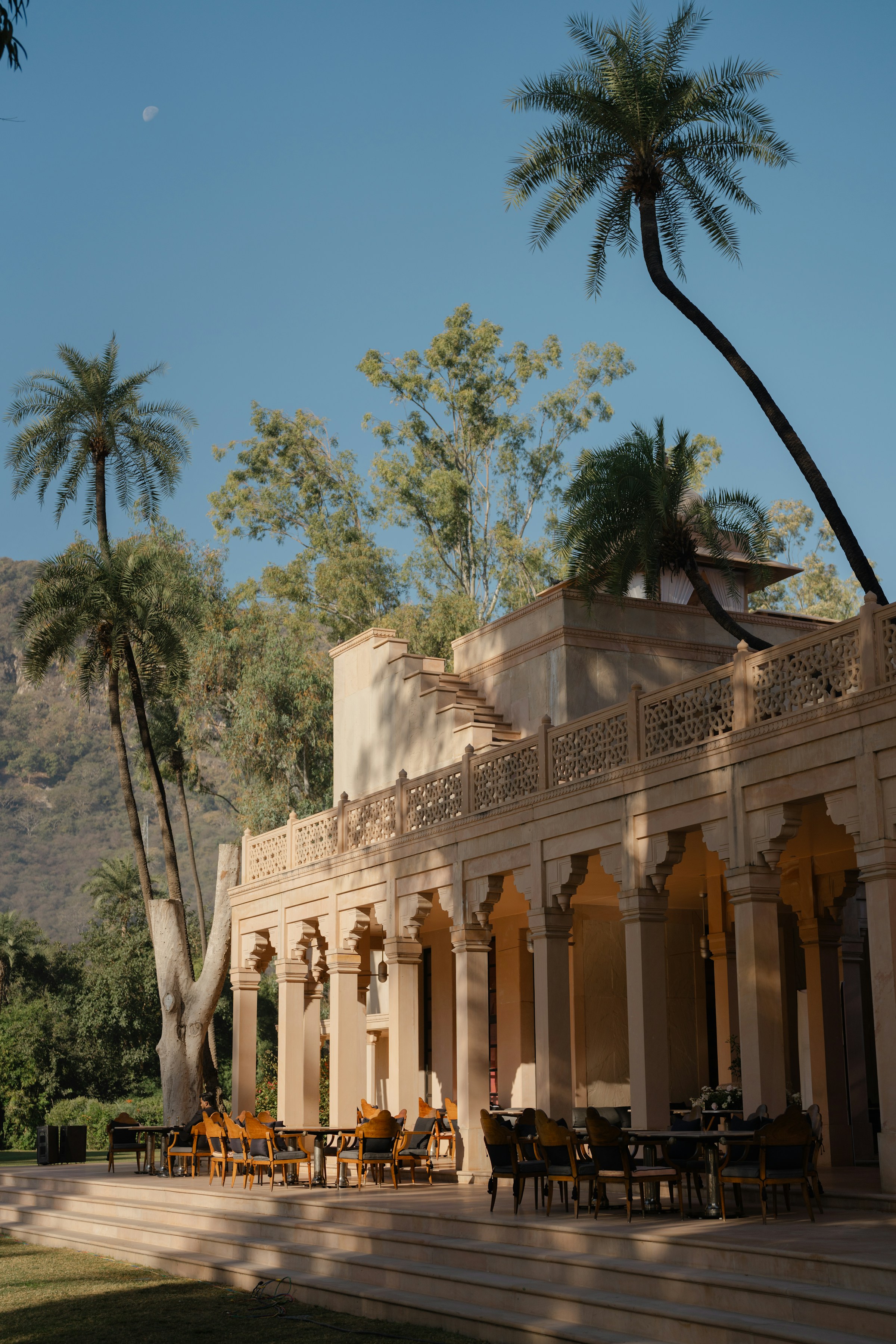 An ornate boutique villa with palm trees